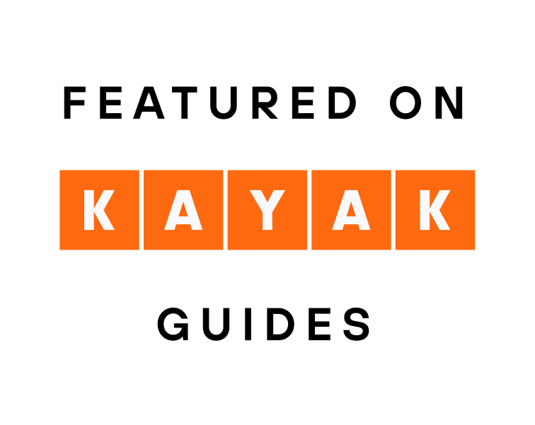 White graphic featuring the text "FEATURED ON" in black uppercase letters, followed by the "KAYAK" logo in white letters inside orange squares, and the word "GUIDES" in black uppercase letters at the bottom.